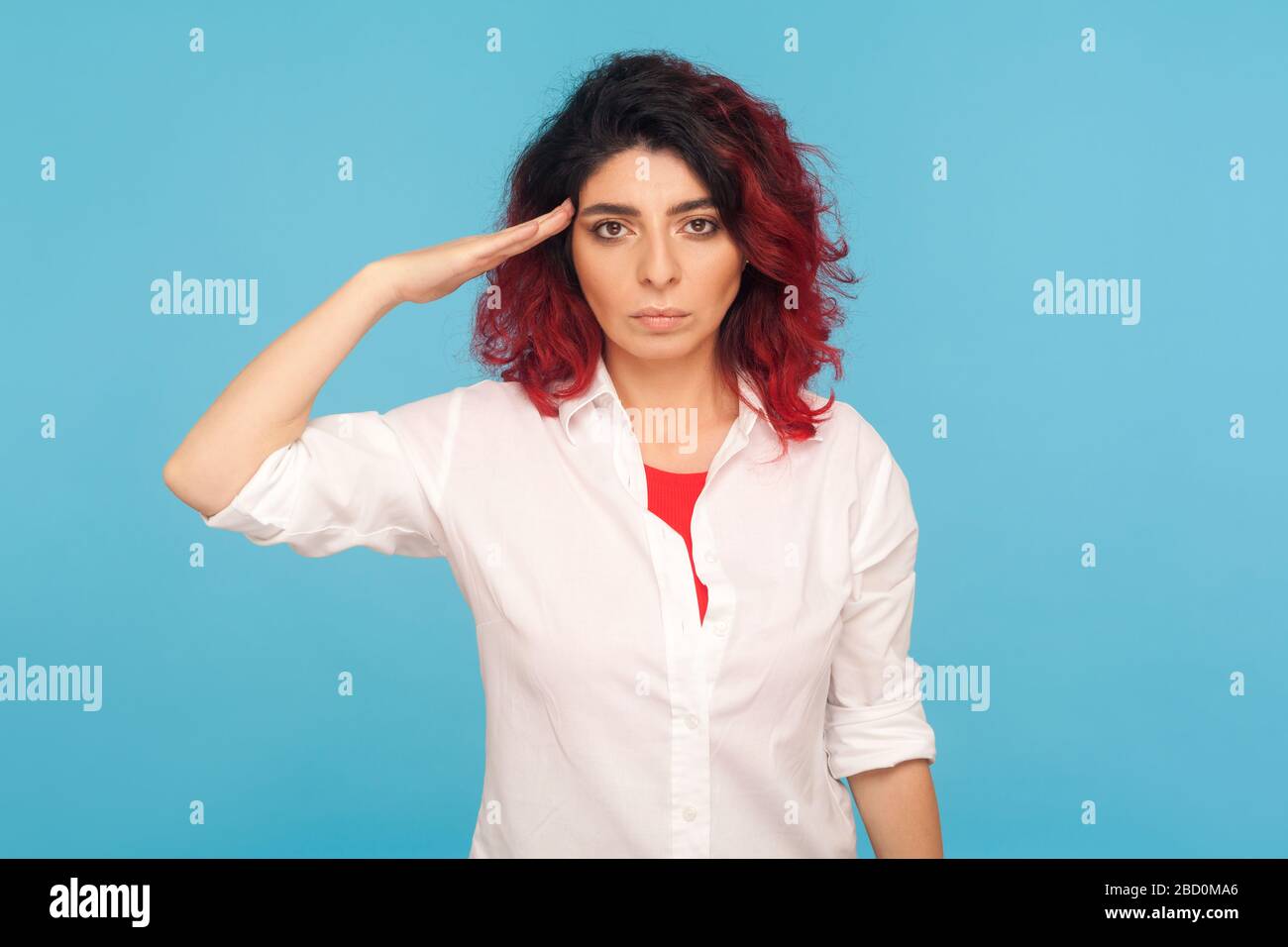 Yes sir! Portrait of responsible serious hipster woman with fancy red