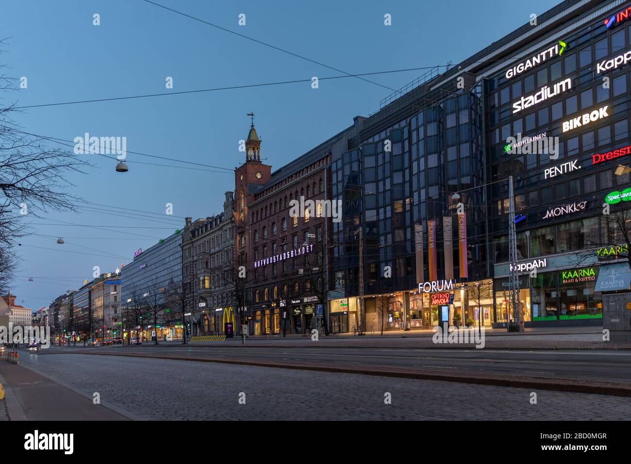 Closing restaurants due to coronavirus pandemic has emptied the streets of Helsinki. Main street in city, Mannerheimintie, has only a few cars on it. Stock Photo