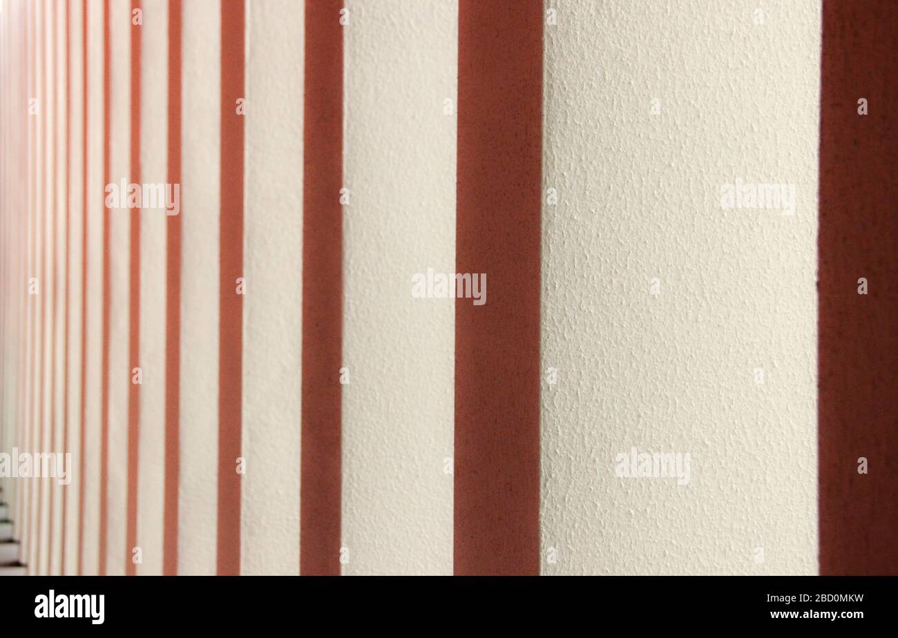 Abstract wall surface with stripes red and white in prospective Stock Photo