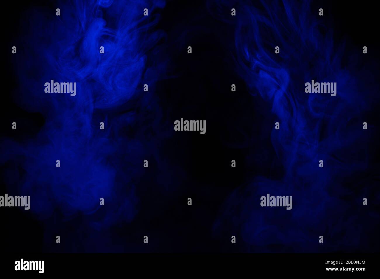 Blue smoke clouds on black, abstract background Stock Photo