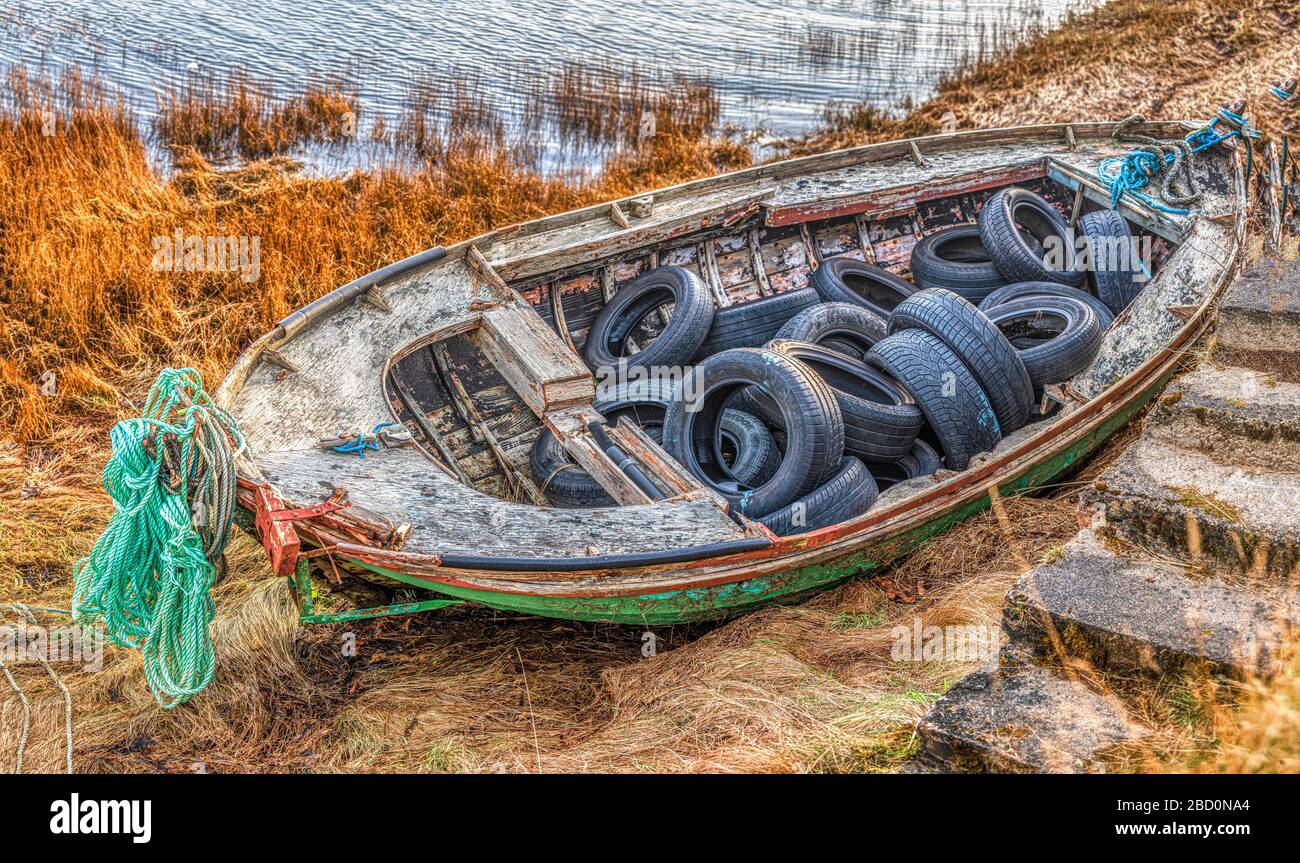 derelict boat on shore Stock Photo