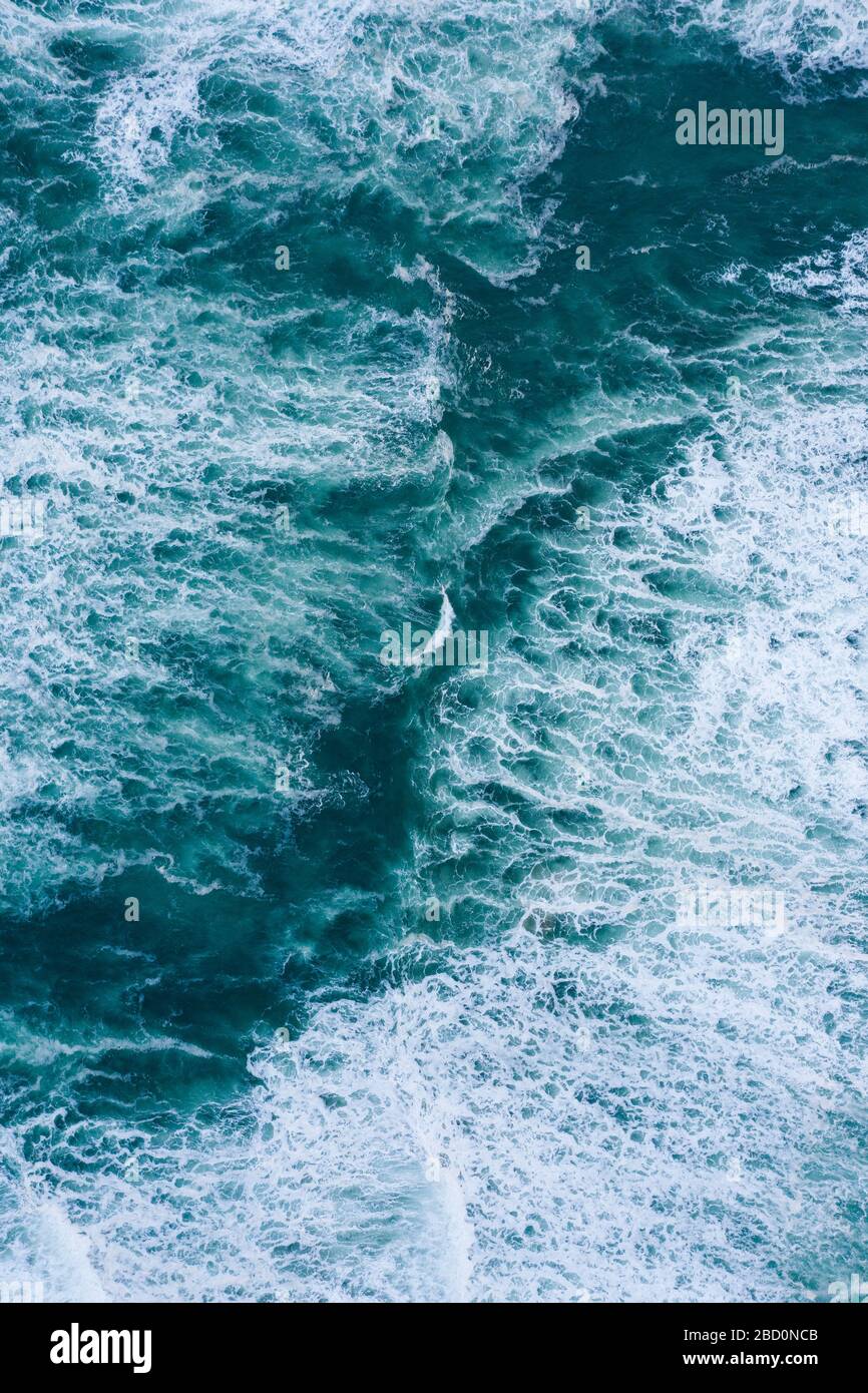 Blue foamy ocean waves and sand aerial drone top view Stock Photo - Alamy