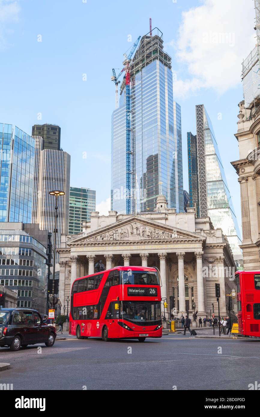 London, United Kingdom - April 25, 2019: Modern Red double-decker bus with passengers is going down the street of London city, ordinary people walk th Stock Photo
