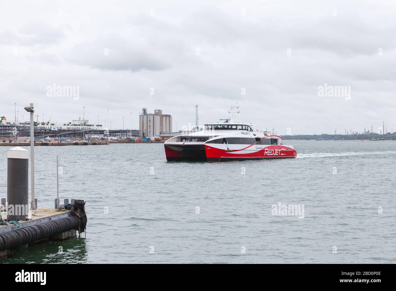 Southampton, United Kingdom - April 24, 2019: Fast passenger ferry arrives the port of Southampton. MV Red Jet 7 is a high-speed Catamaran ferry of Re Stock Photo