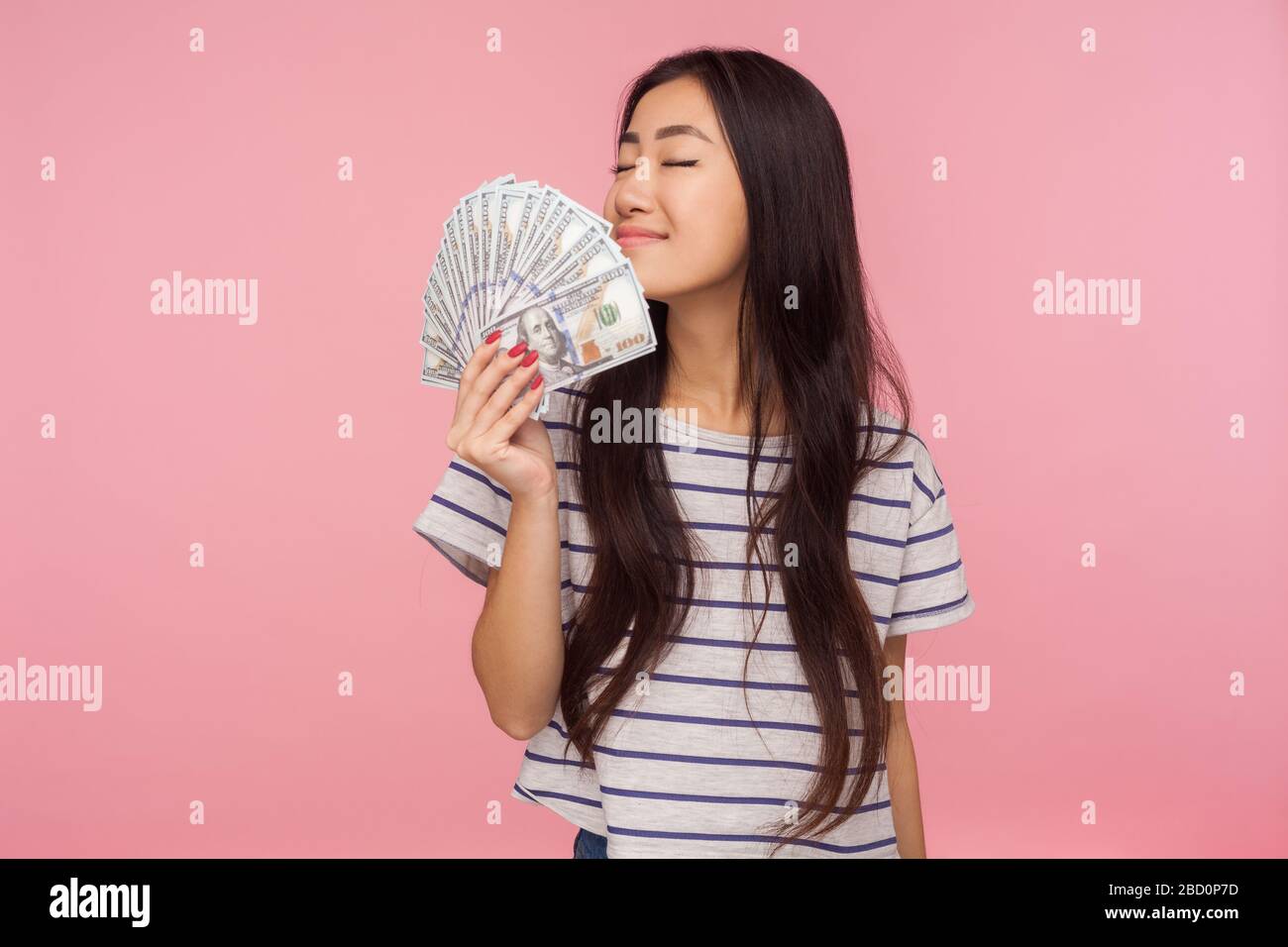 Using Greedy Girl Portrait of attractive brunette girl greedy for money holding dollars ...