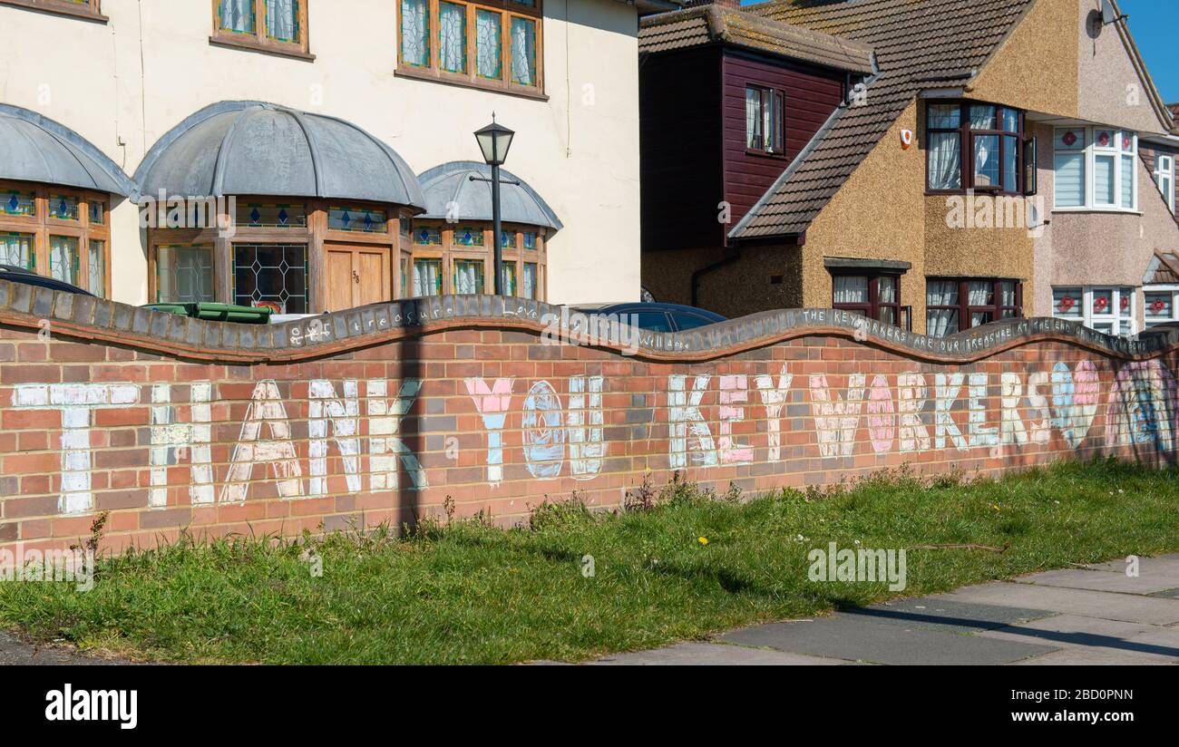 Sign chalked on wall outside a residential home, in gratitude to all keyworkers of various professions who are working during the Coronavirus pandemic. Stock Photo