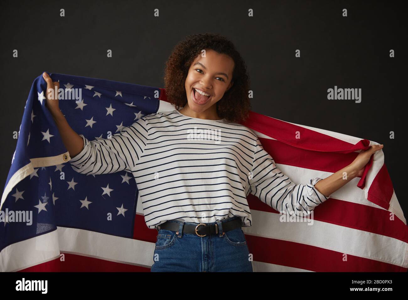 Girl holding american flag hi-res stock photography and images - Alamy