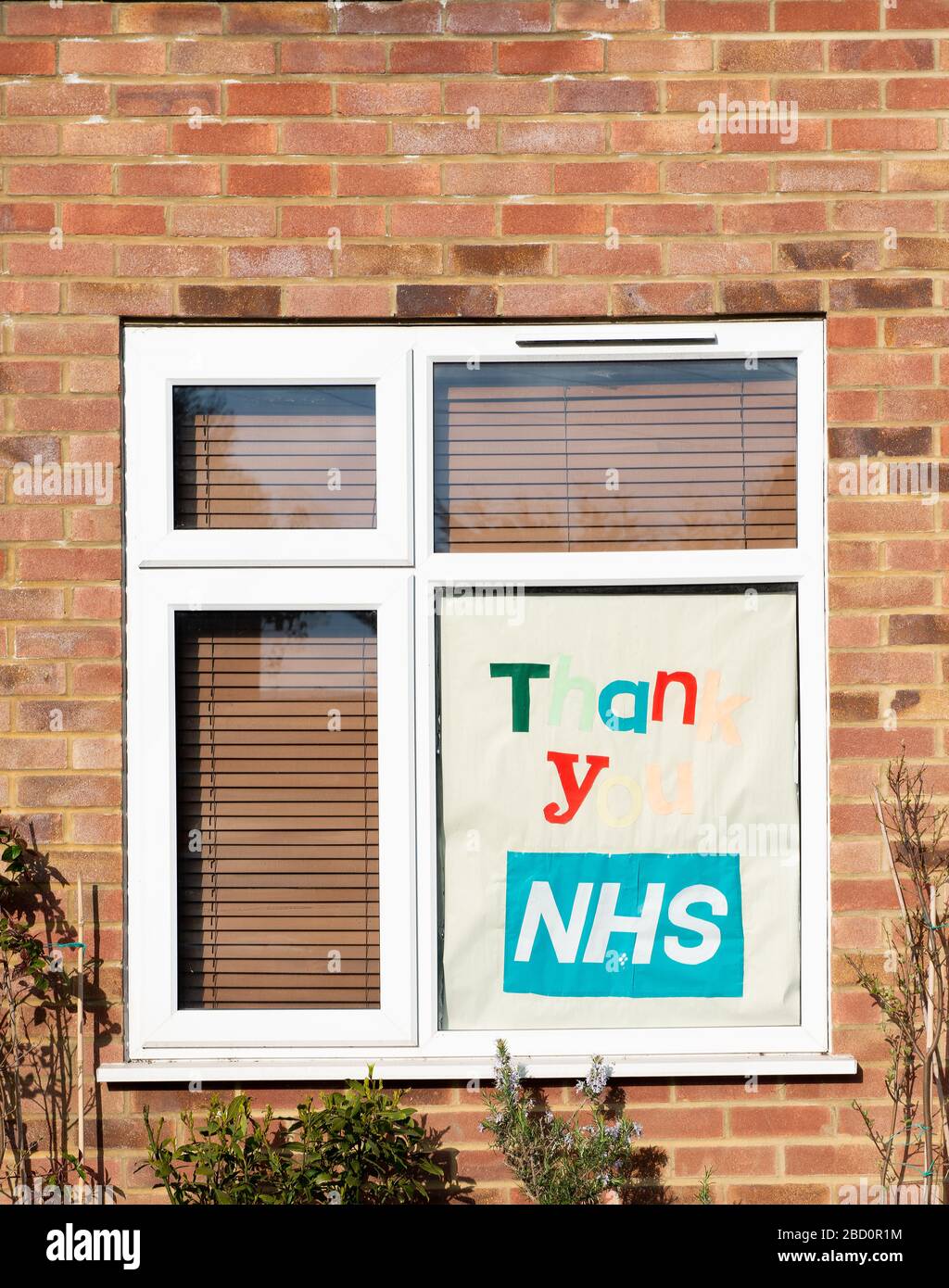 Large homemade sign/poster in the window a residential home, in gratitude to all NHS staff keyworkers who are working during the Coronavirus pandemic. Stock Photo