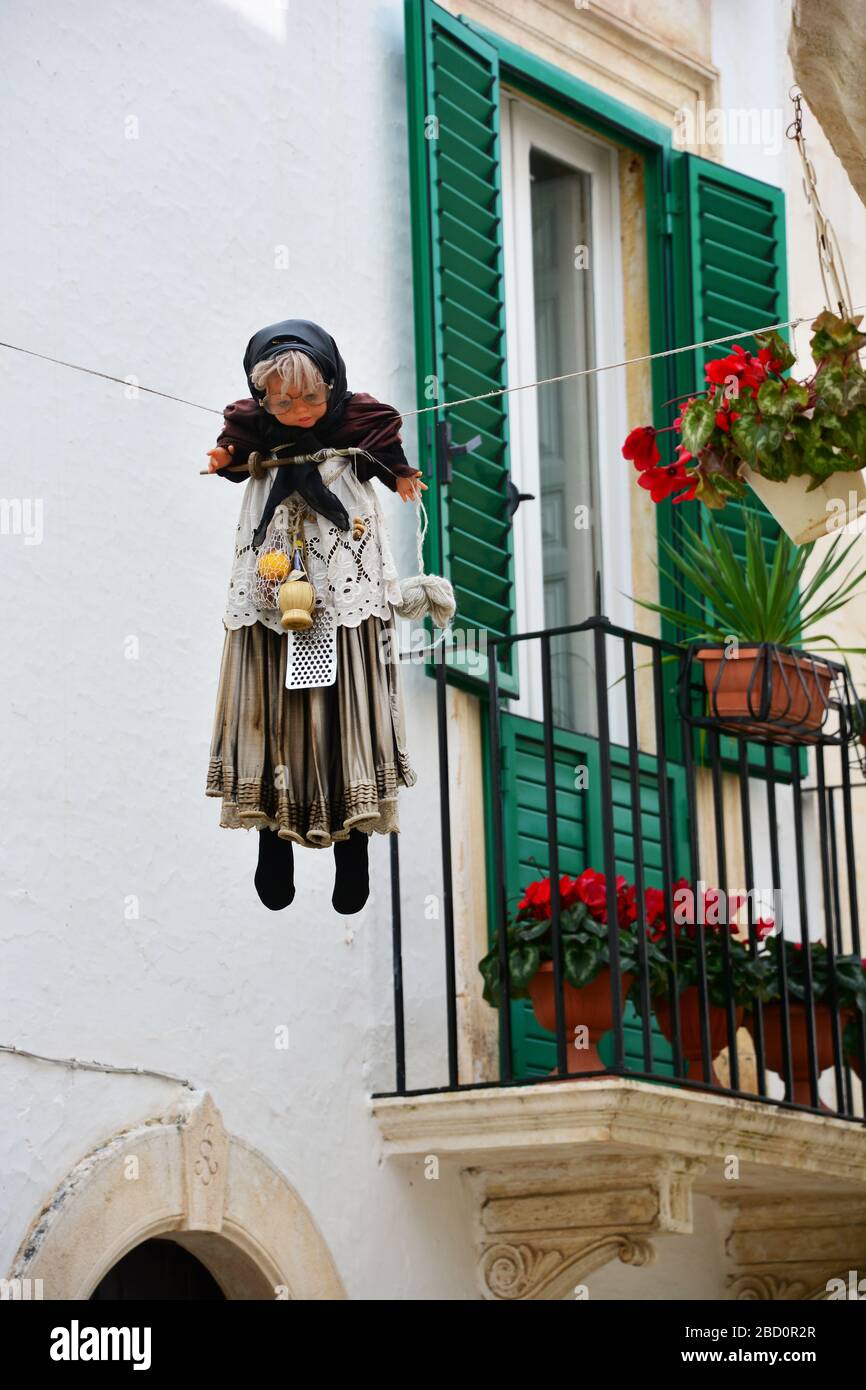Locorotondo, Italy-April 2019: Doll Quarandone hung 40 days to Easter; symbolises penance; destroying it shows the winning of life against death, joy Stock Photo