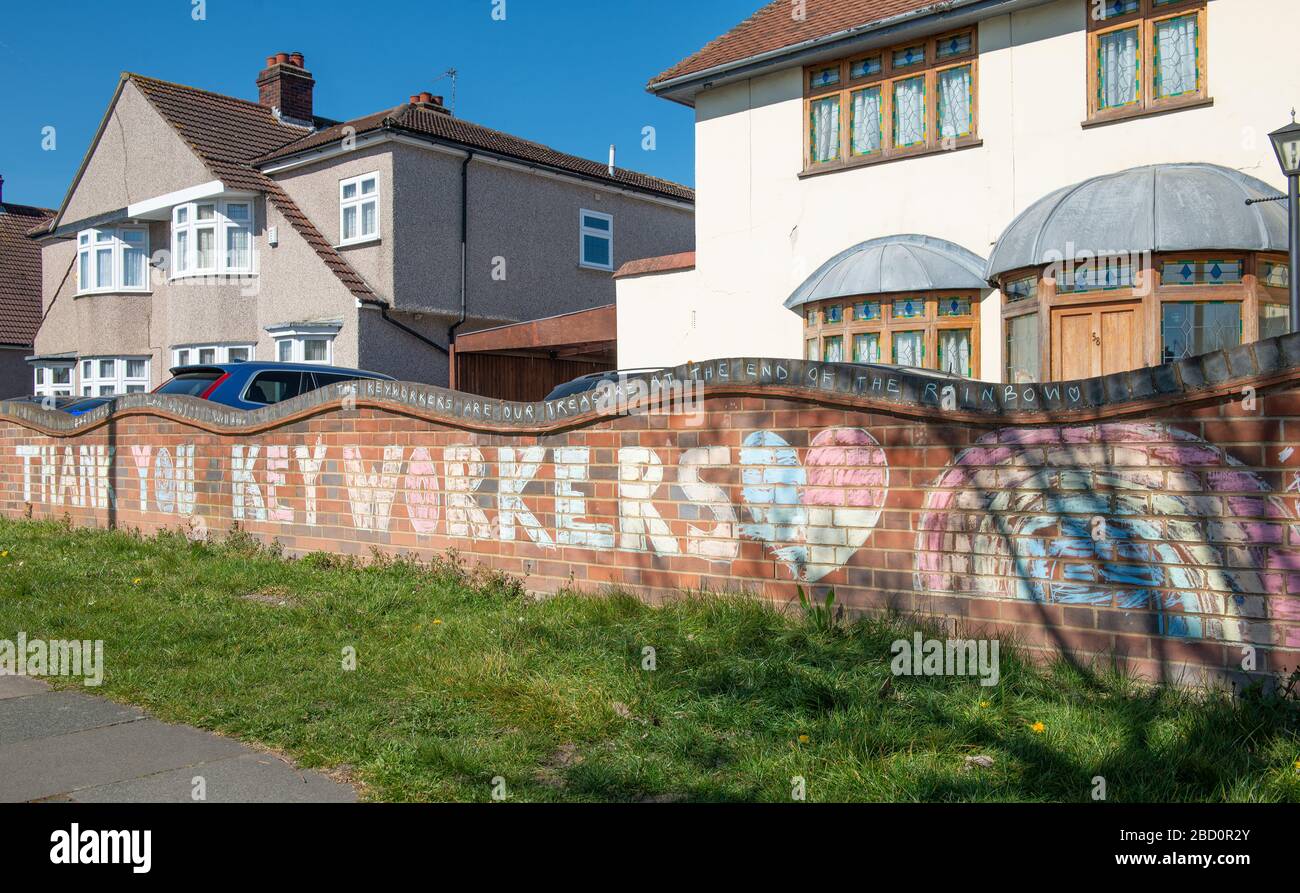 Sign chalked on wall outside a residential home, in gratitude to all keyworkers of various professions who are working during the Coronavirus pandemic. Stock Photo