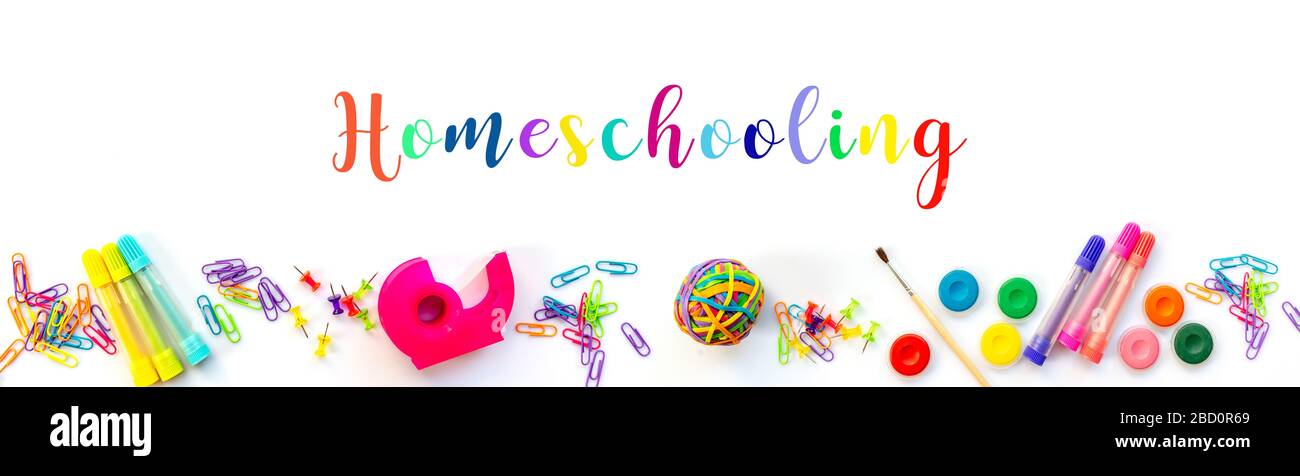 Homeschooling web banner. Panorama of colorful school supplies isolated on white background. Stock Photo