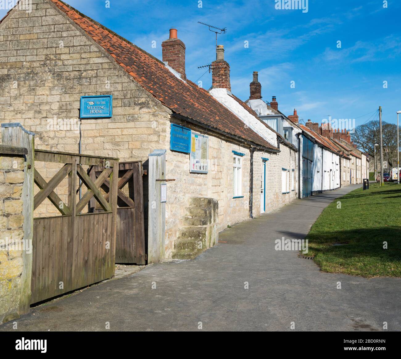 A row of old terraced cottages at Castlegate ,Pickering, North Yorkshire with sunshine and blue sky Stock Photo