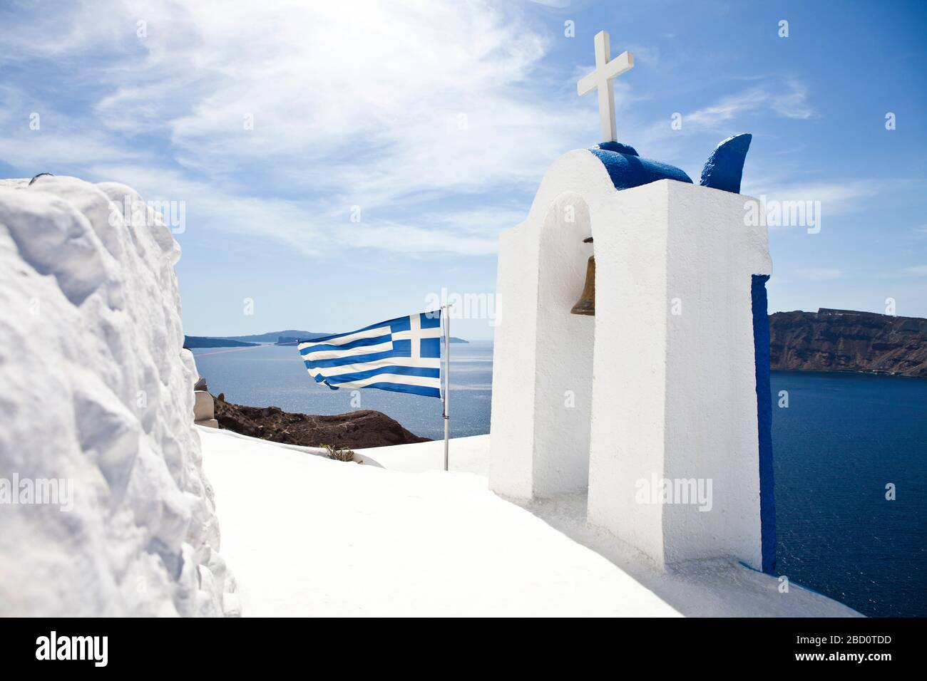 church at Santorini with greek flag Stock Photo