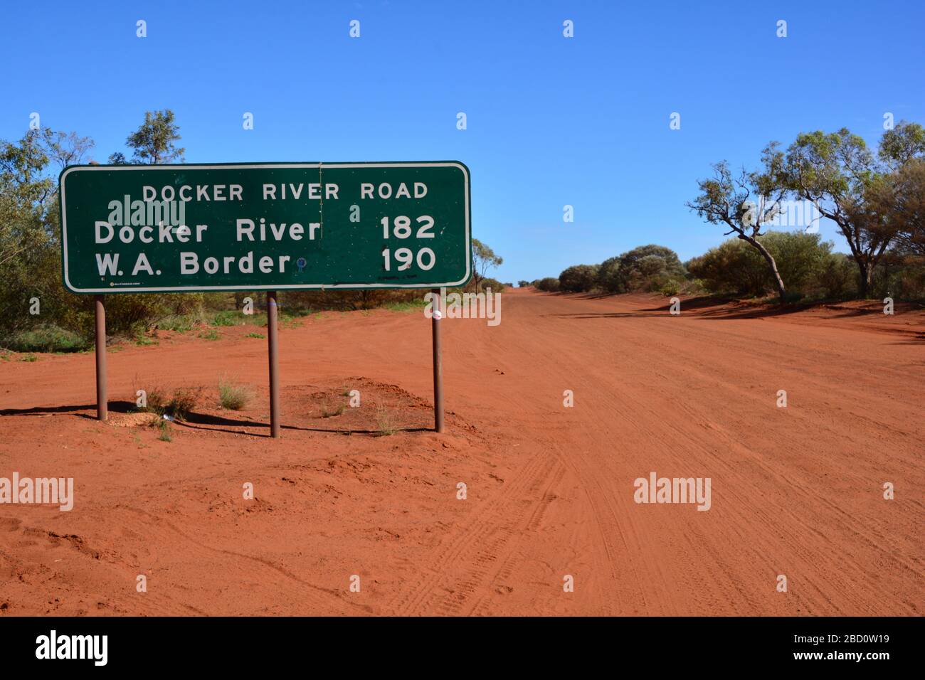 Close up of road signs at the beginning of long red dust road to Western Australia, taking from the Northern Territory, Australia Stock Photo