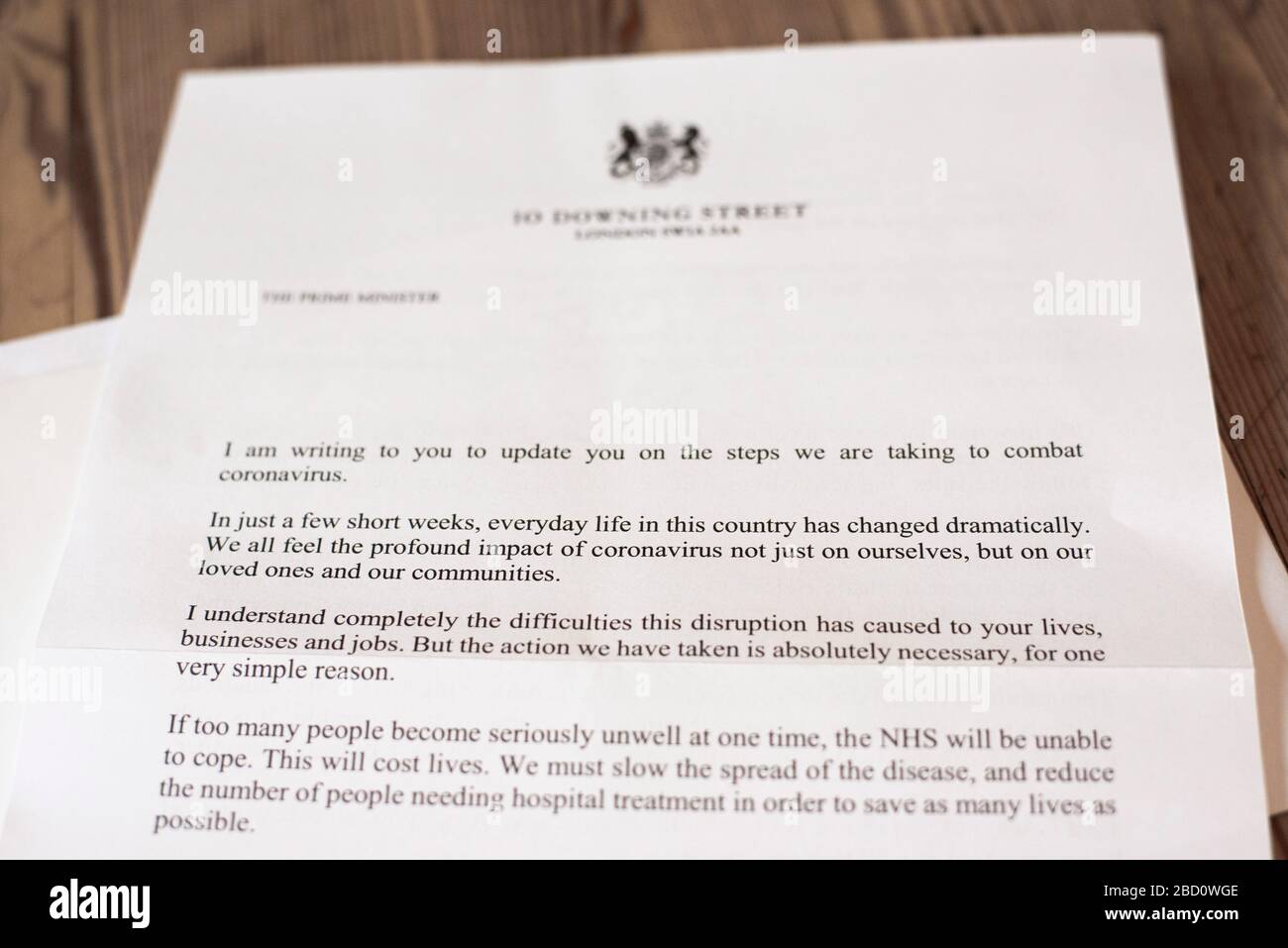 General view of a letter recieved in the post from Prime Minister Boris Johnson to a home in London, UK on April 6, 2020. The letter warns that the outbreak will get 'worse before it gets better ', thanking the NHS and urging people to stay at home. Sent to 30 million British households, a leaflet with hand washing guidance, rules on leaving home, how to self-isolate and protect vulnerable people is included. Symptoms of coronavirus are also be explained. Last night Prime Minister Boris Johnson was admitted to hospital for tests after showing persistent symptoms of coronavirus 10 days after t Stock Photo