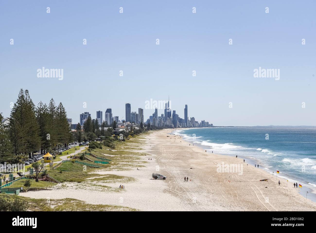 A view of a beach and Surfers Paradise on the Gold Coast.New South Wales and Queensland cities decide to shutdown beaches. Australian authorities are taking actions to reduce crowded places including beaches to stop the spread of Covid-19. Stock Photo