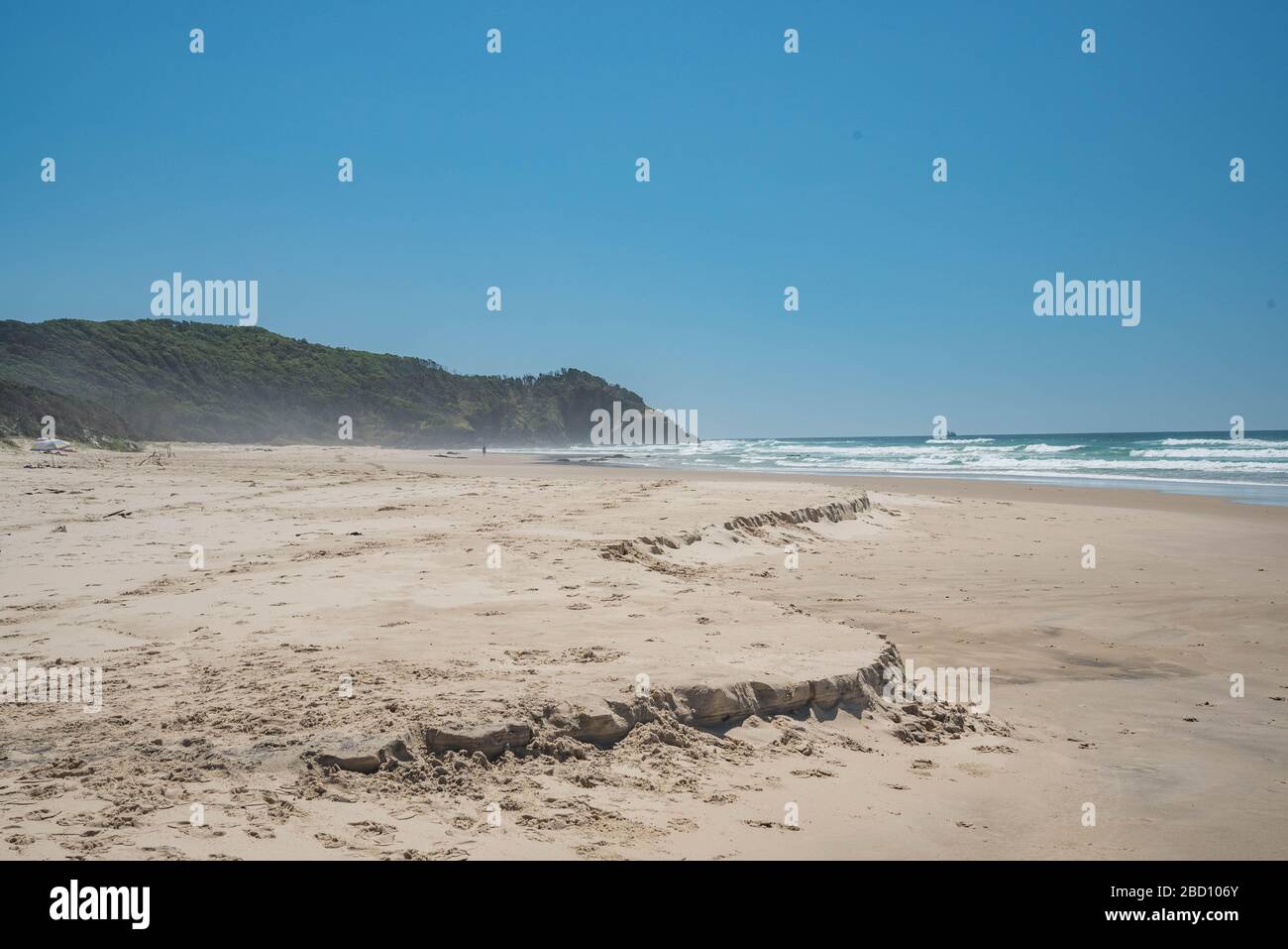 A view of a deserted Broken Head beach near Byron Bay.New South Wales and Queensland cities decide to shutdown beaches. Australian authorities are taking actions to reduce crowded places including beaches to stop the spread of Covid-19. Stock Photo