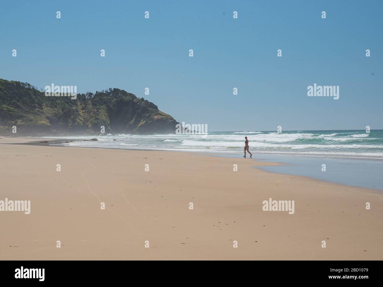 A view of semi deserted Broken Head beach near Byron Bay.New South Wales and Queensland cities decide to shutdown beaches. Australian authorities are taking actions to reduce crowded places including beaches to stop the spread of Covid-19. Stock Photo