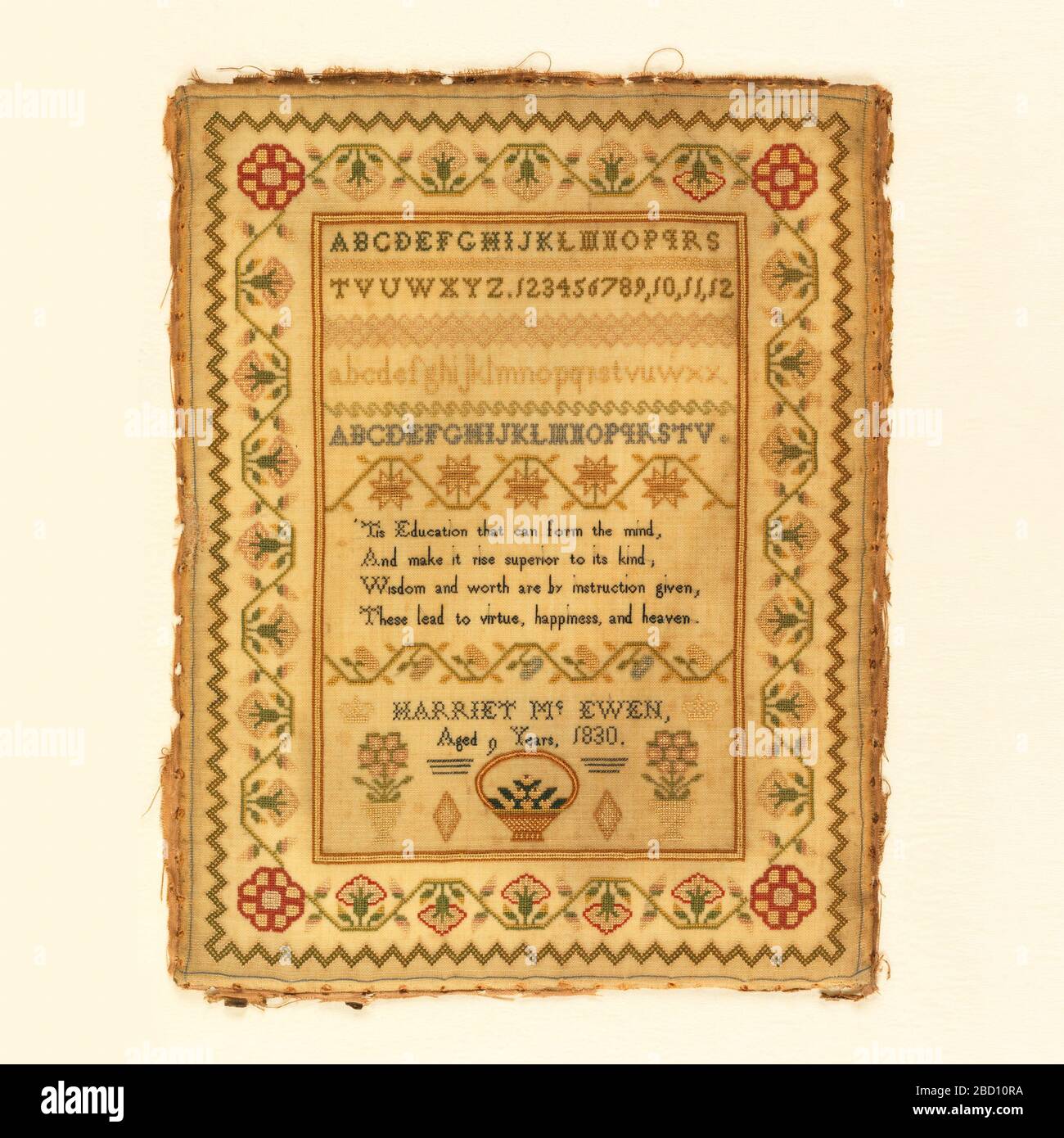 Sampler. Research in ProgressFour alphabets, one with numerals at the top. Verse: 'Tis education that conform the mind, and make it rise superior to its kind, wisdom and worth are by instruction given, these lead to virtue, happiness, and heaven. Sampler Stock Photo