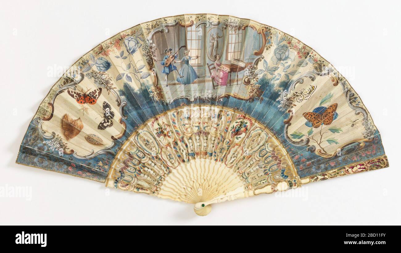 Pleated fan and case. Pleated fan with a painted parchment leaf with three cartouches: the center shows an interior with a man and two women playing music and dancing; the two side cartouches show butterflies and shells. Scattered insects on the reverse, with a floral border. Pleated fan and case Stock Photo