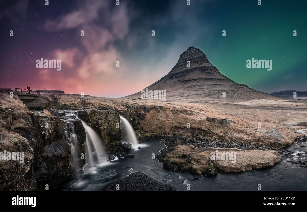 Northern Lights Aurora Borealis Over Kirkjufell Waterfall In Iceland