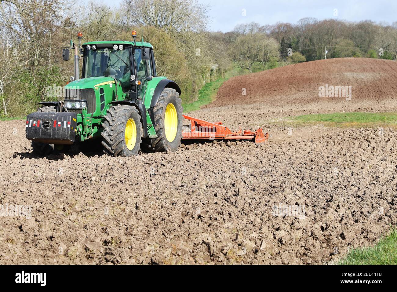 John deere tractor harrowing field hi-res stock photography and images ...