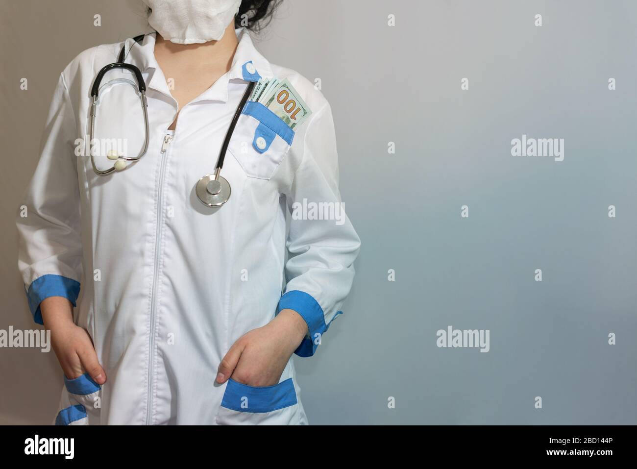 Bribe. Hundred dollar bill in the pocket of a Doctor or paramedic. Corruption in medicine, pharmaceuticals. The concept of paid medicine. Stock Photo