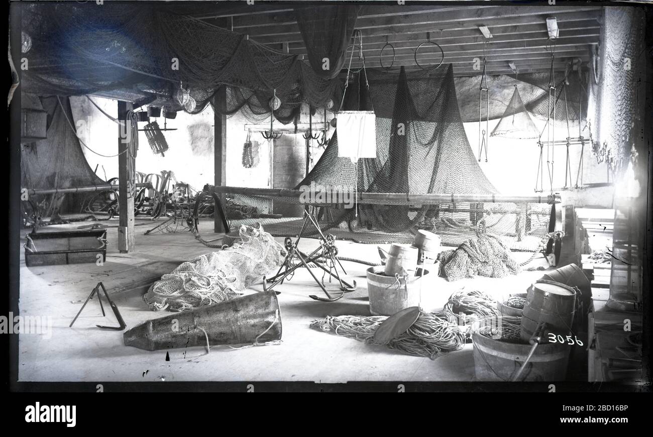 Workspace Featuring Fishing Implements. Workspace featuring fishing implements such as nets, hooks, baskets, cages, ropes, and buckets.Smithsonian Institution Archives, Acc. 11-006, Box 007, Image No. MAH-3056 Stock Photo