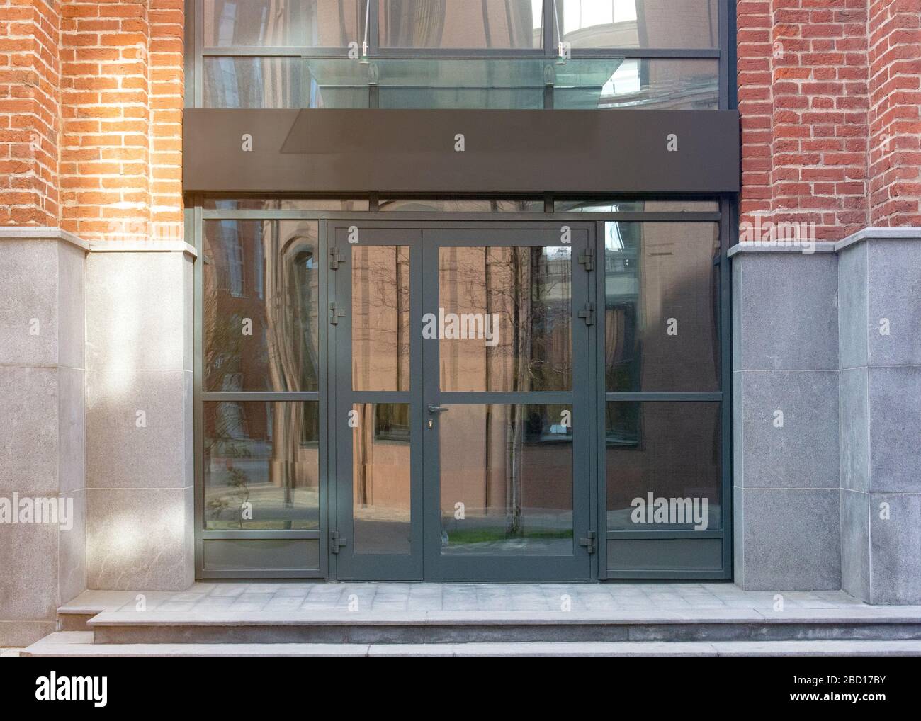 Blank black rectangular box store entrance mockup, glass brick wall Stock Photo