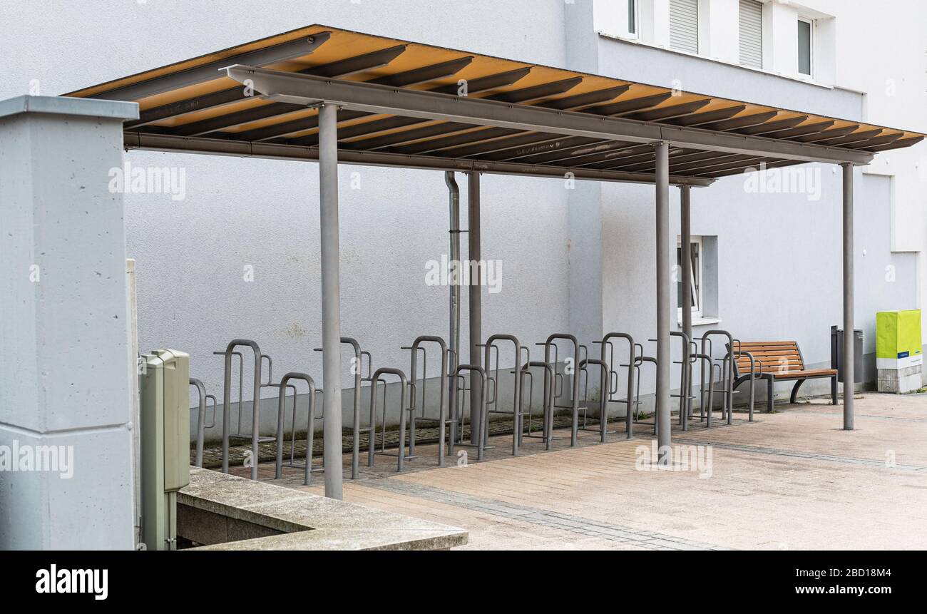 Bicycle parking in the city. Transportation in the city. Steel constructions. Sport is health. Empty parking place. Ecological transport. Stock Photo