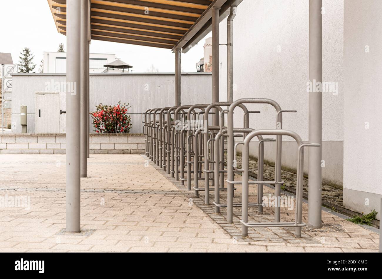 Bicycle parking in the city. Transportation in the city. Steel constructions. Sport is health. Empty parking place. Ecological transport. Stock Photo