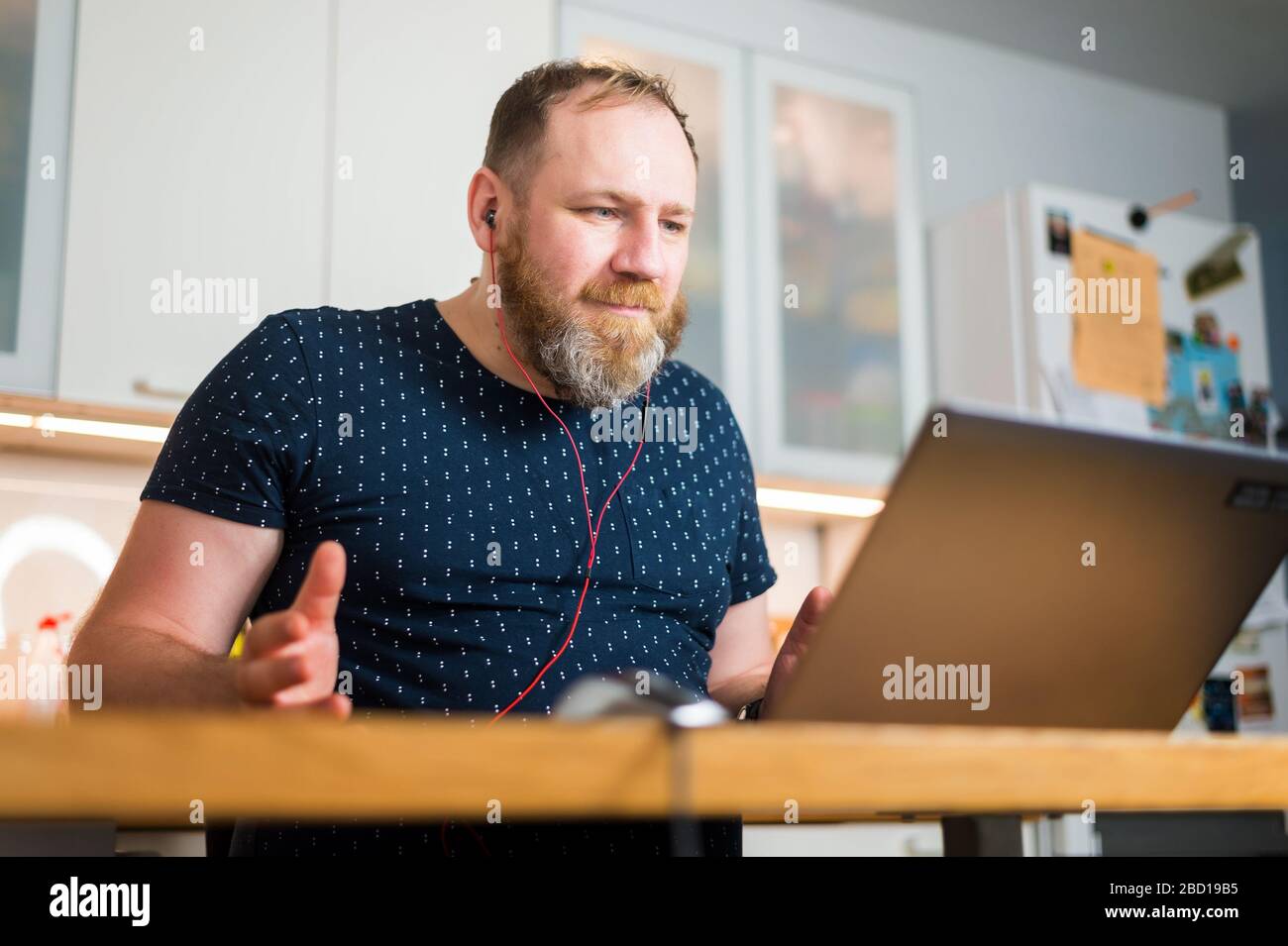 IT specialist provide online meeting not from office but from his home, remote work, work from home. Quarantine time Stock Photo