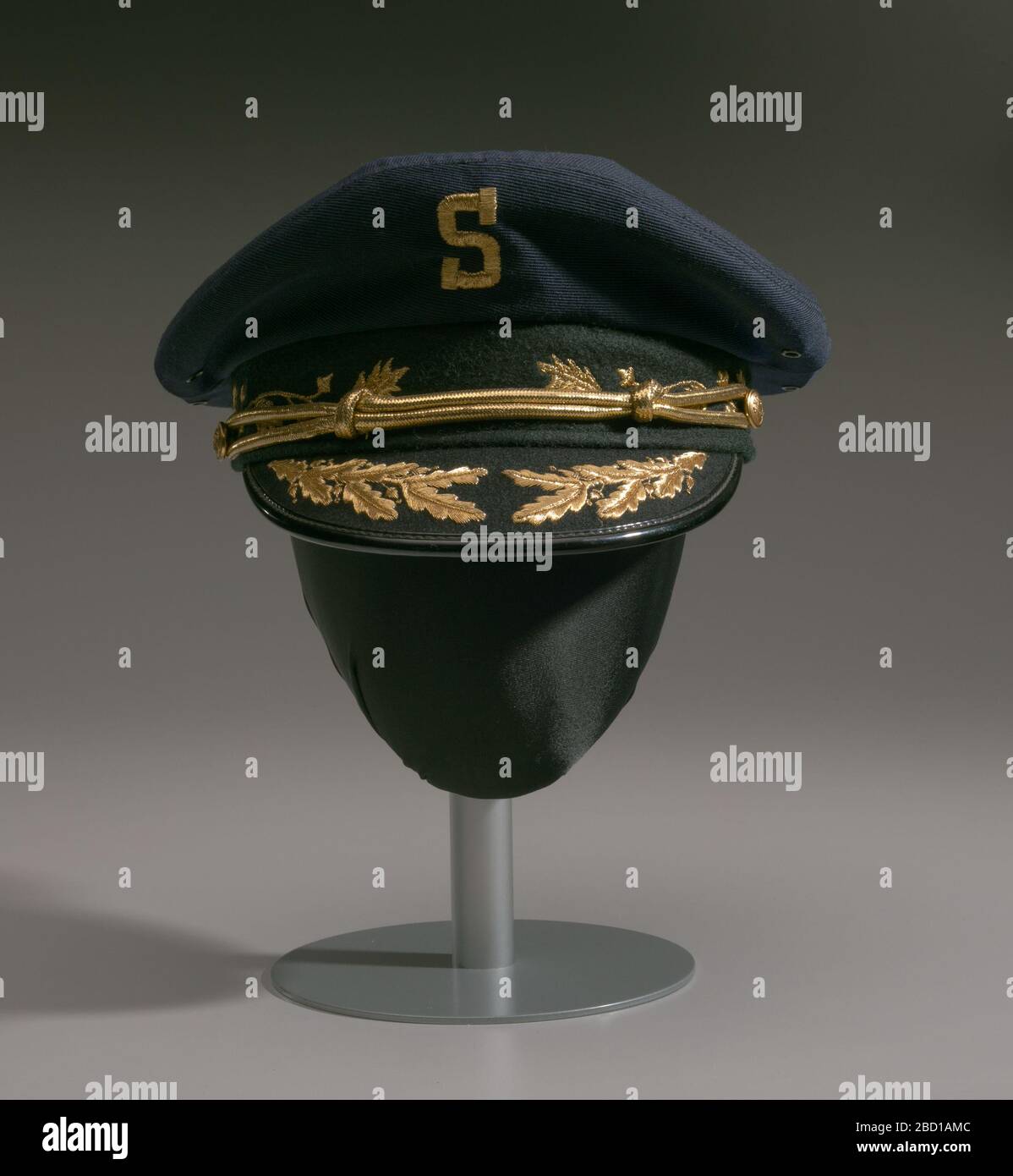 Hat worn by Dr Issac Greggs with The Human Jukebox marching band. A hat worn by Dr. Issac Ben Greggs, the Director of the Southern University - Baton Rouge marching band nicknamed 'The Human Jukebox.' The military-style peaked cap has a navy crown with an gold embroidered “S” at center front. Hat worn by Dr Issac Greggs with The Human Jukebox marching band Stock Photo