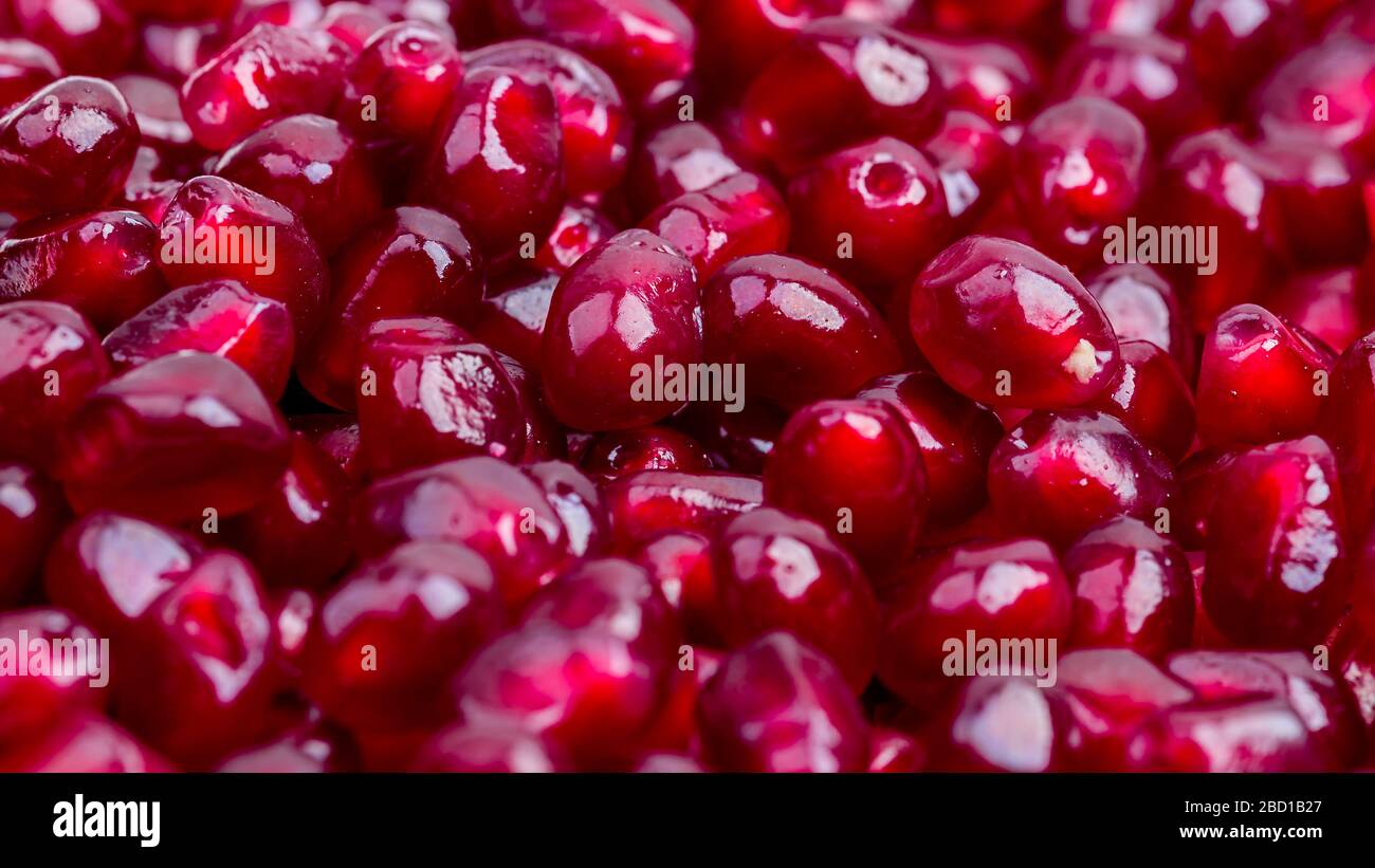 Texture of red ripe pomegranate seeds closeup Stock Photo