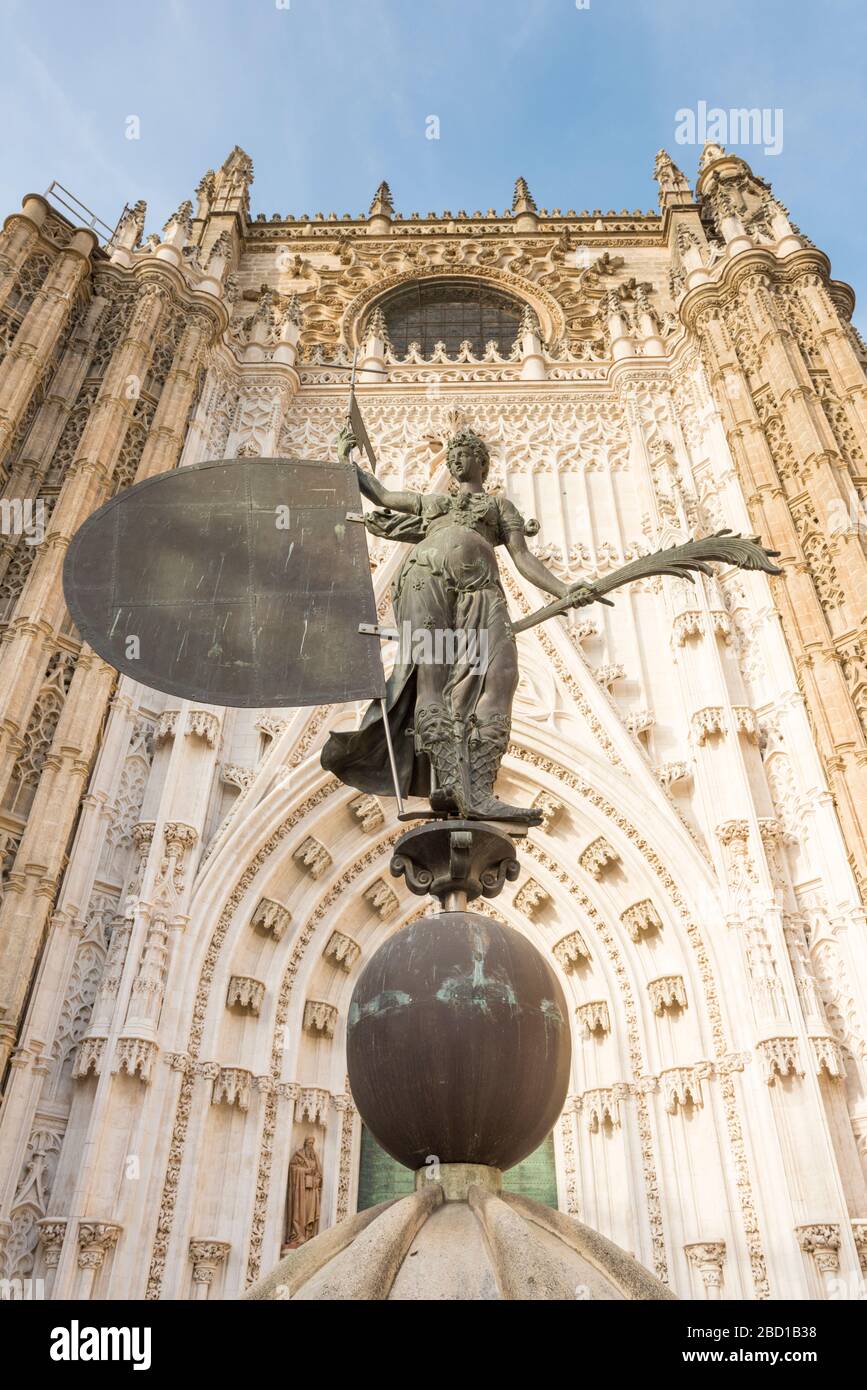 A bronze statue outside the Seville cathedral in Seville Spain Stock