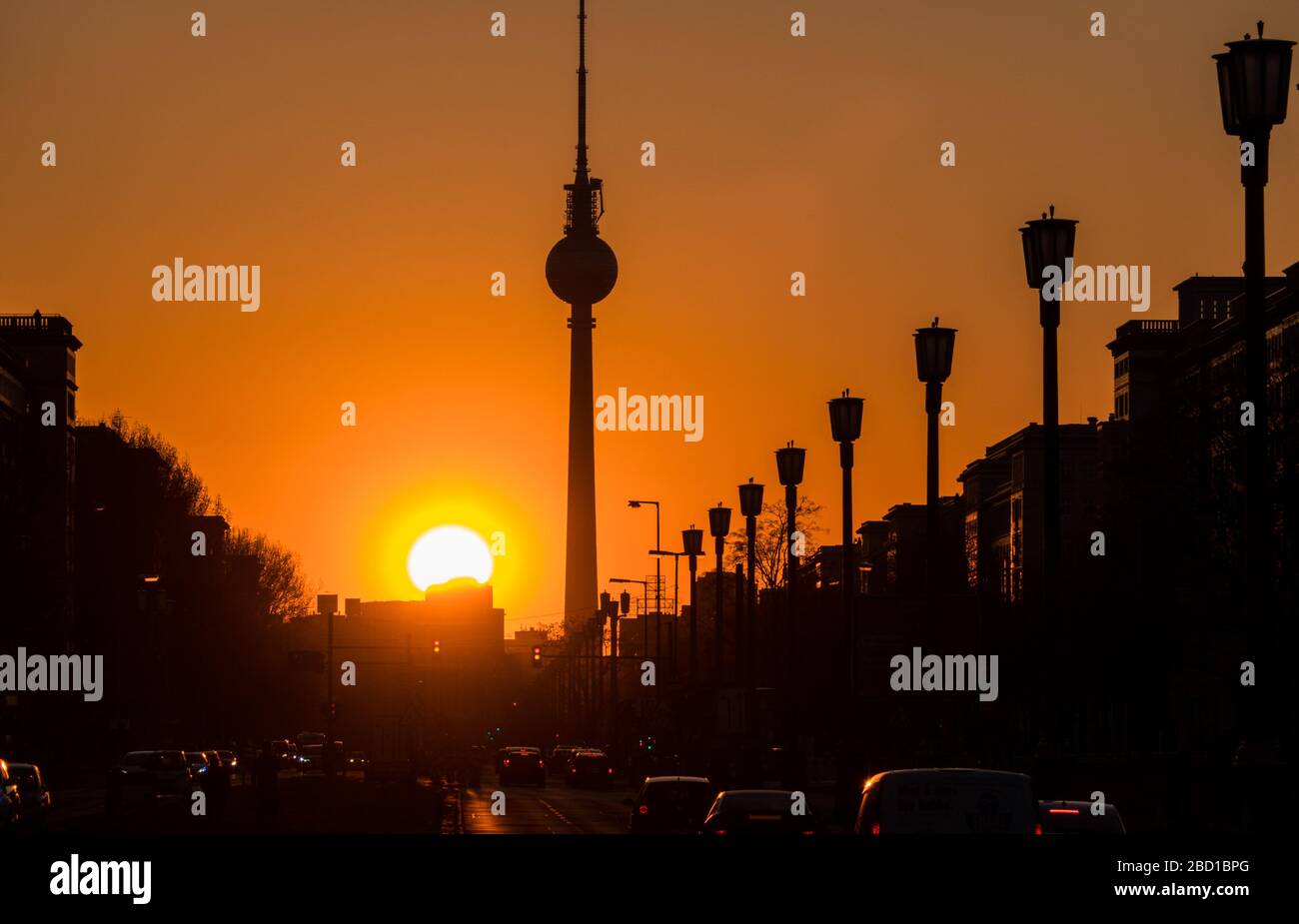 Berlin, Germany. 06th Apr, 2020. The sun sets behind the television tower and over Karl-Marx-Allee. Credit: Soeren Stache/Zentralbild/ZB/dpa/Alamy Live News Stock Photo