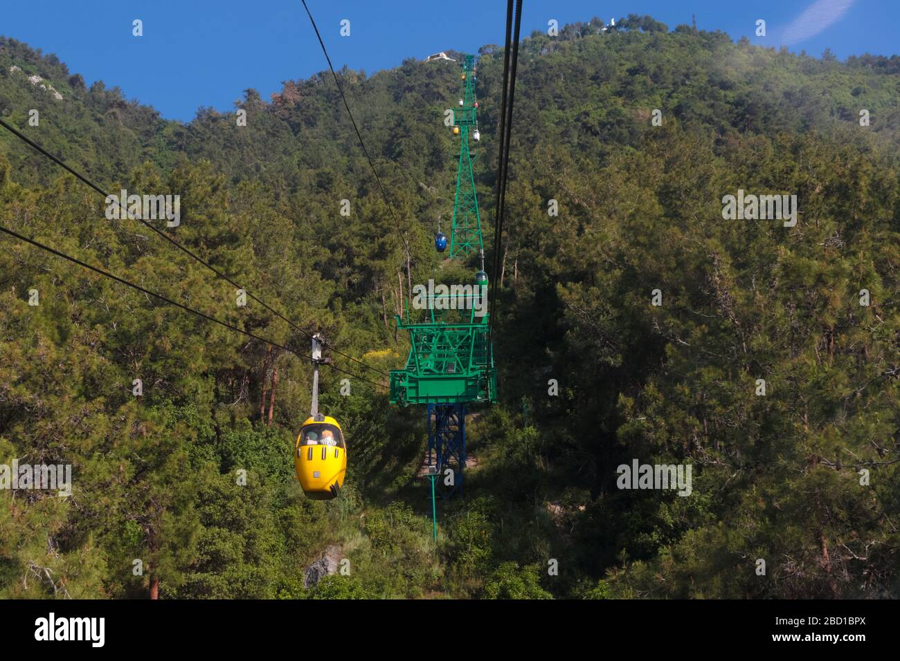 Jounieh, Lebanon - May 13, 2017: Locals commuting in a cable car to the Harissa cathedral in the mountain. Stock Photo