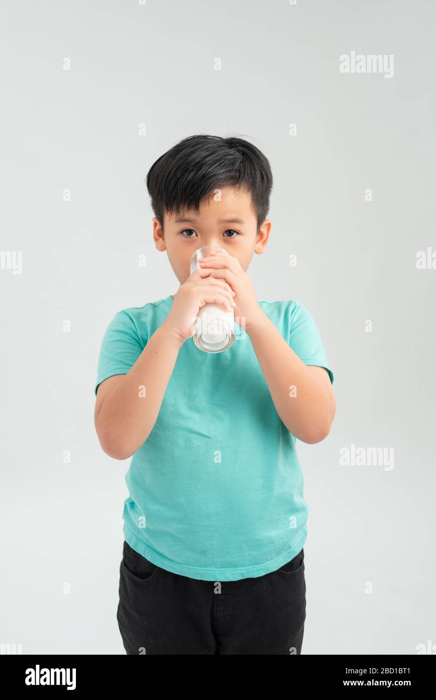 A drinking milk boy on the white background. Stock Photo