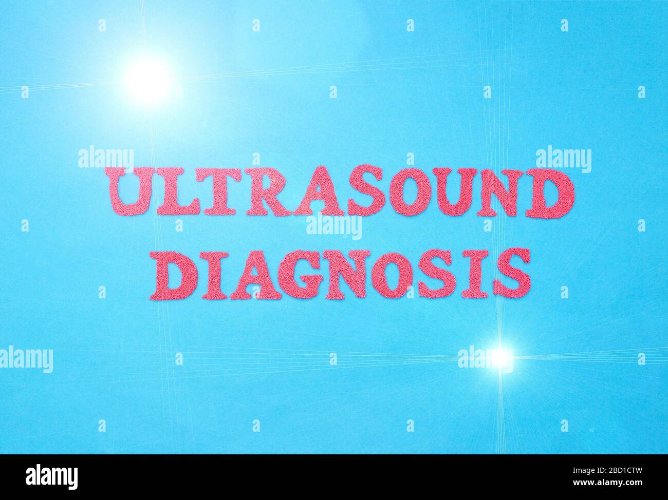 Inscription ultrasound diagnosis in red letters on a blue background. The concept of examination of human organs and the detection of diseases using u Stock Photo