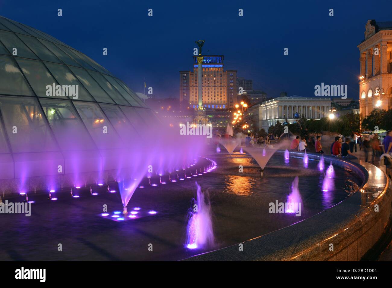 Kiev, Kievskaya Oblast/Ukraine - 05.17.2013. Evening on Maidan Nezalezhnosti (Independence Square). Fountains are highlighted, people are hanging out. Stock Photo