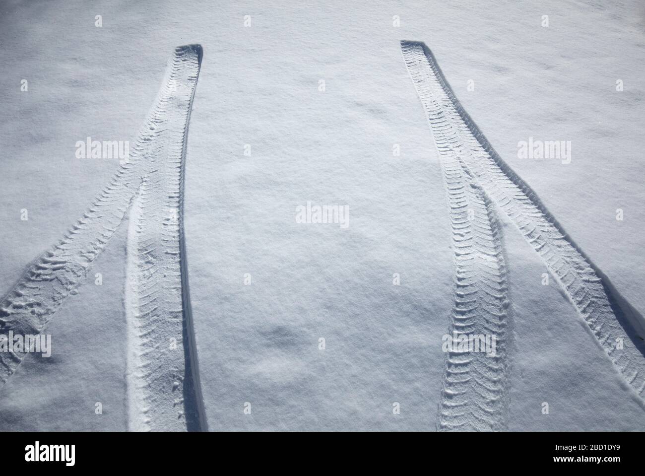 Car tire tracks ending on snow , Finland Stock Photo