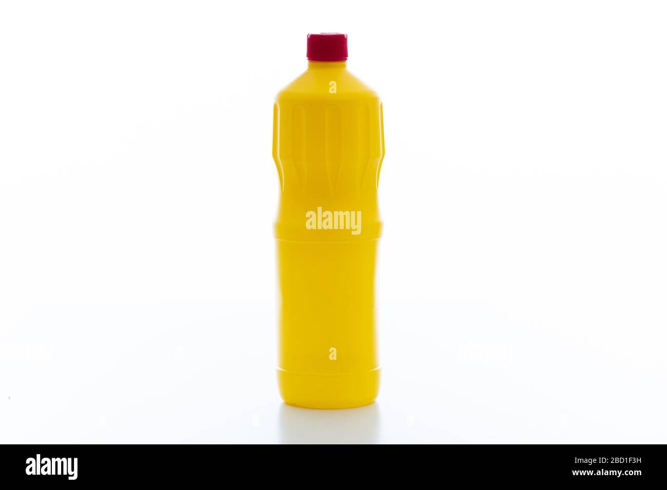 Cleaning chlorine bleach bottle yellow color with red lid isolated against white background. Chemical household product for laundry and disinfection, Stock Photo