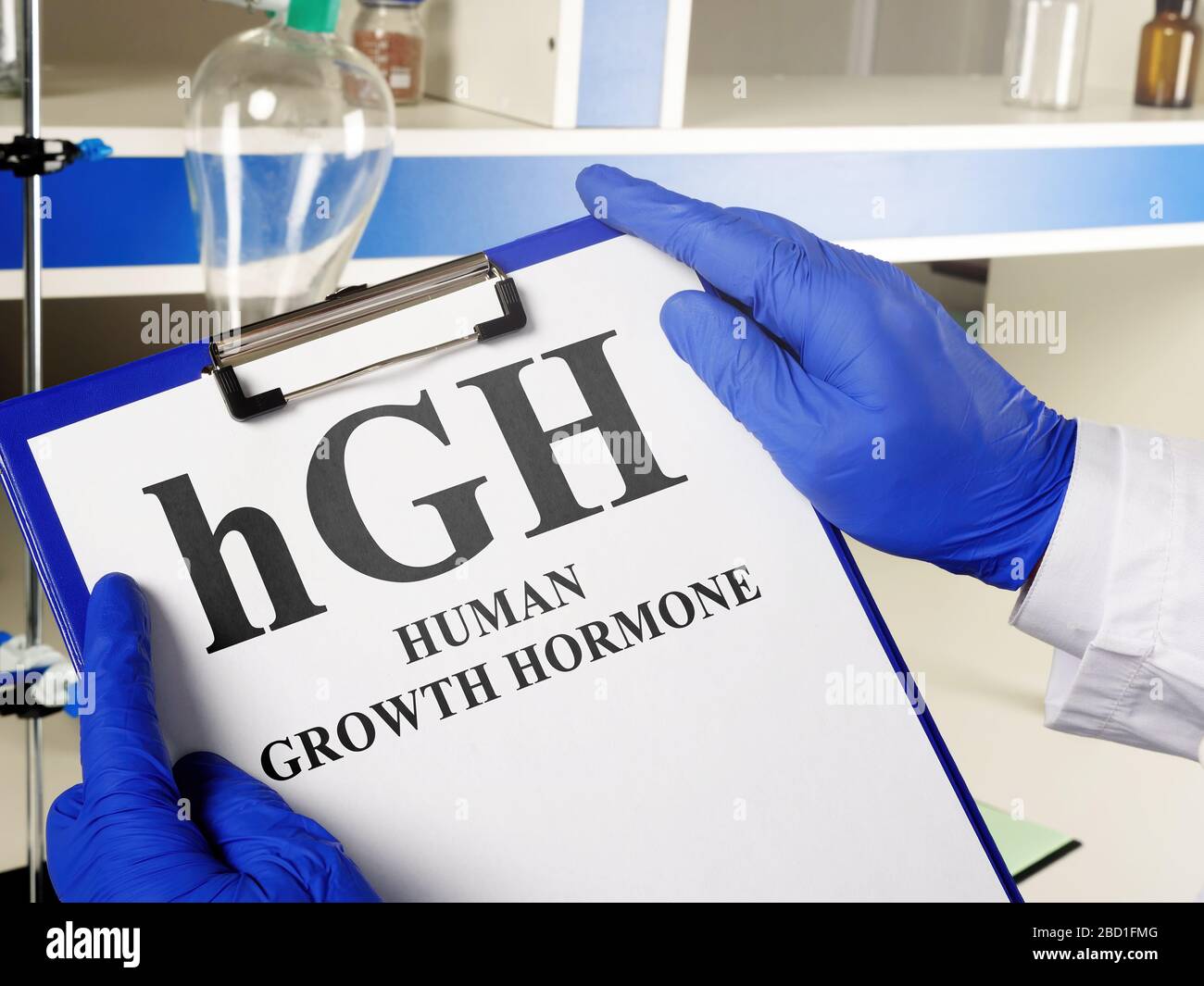 Doctor shows hGH Human growth hormone sign. Stock Photo