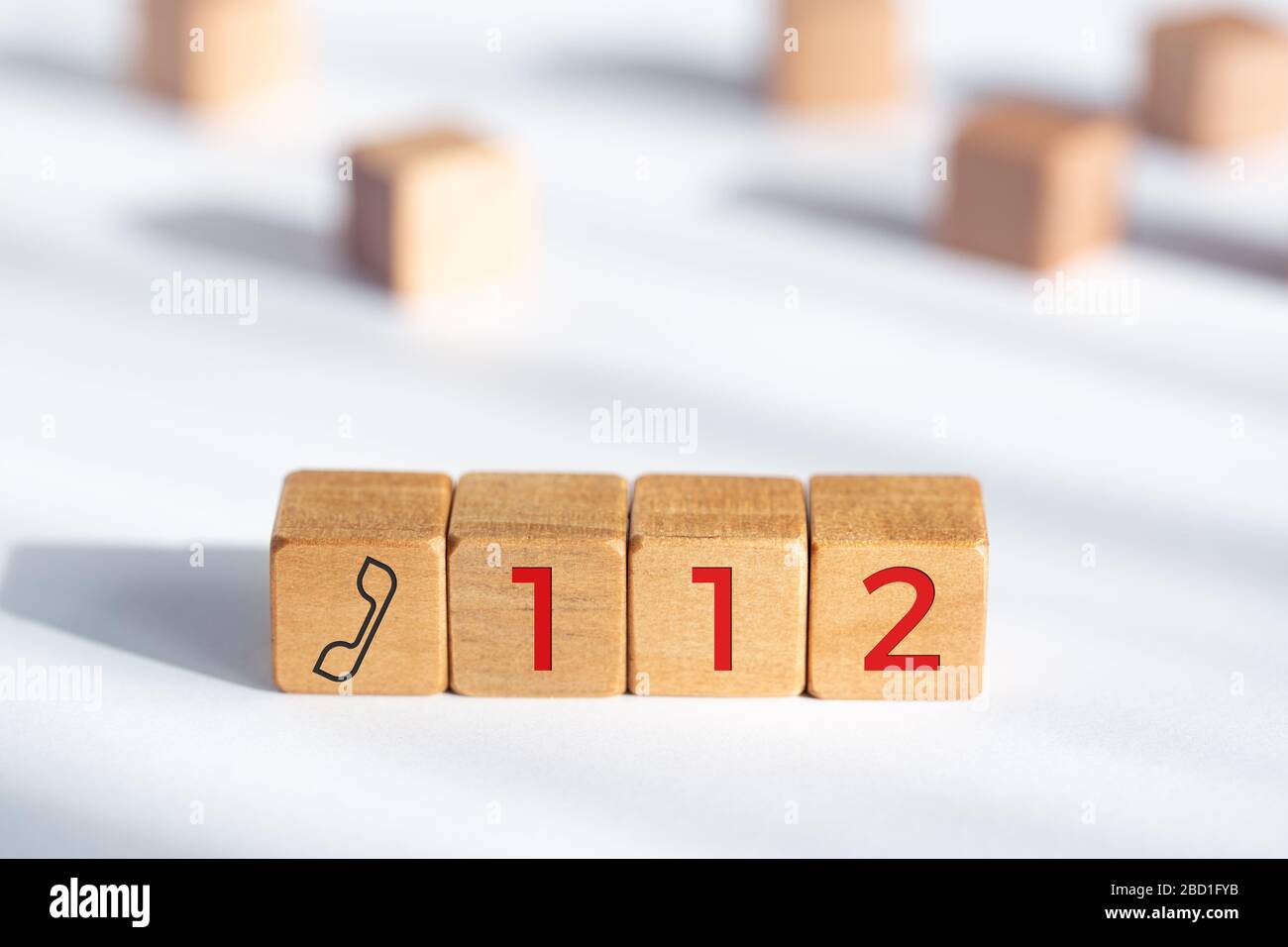 112 emergency concept. Wooden dices with phone icon and 112 text Stock Photo