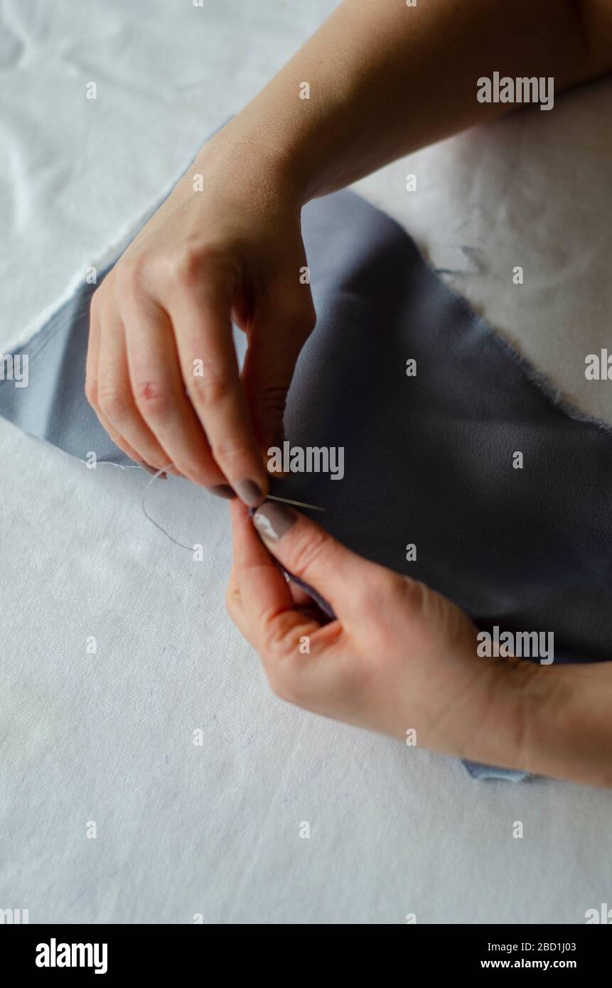 Tailor Sews a Dress 2 Stock Photo