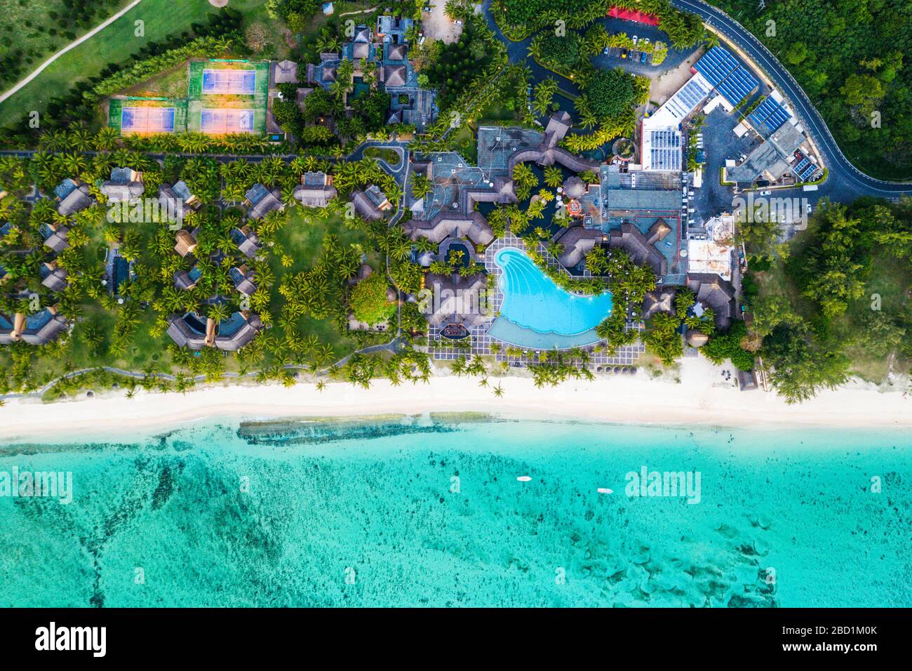 Aerial view by drone of luxury tourist resort on palm-fringed beach facing the tropical lagoon, Le Morne Brabant, Mauritius, Indian Ocean, Africa Stock Photo