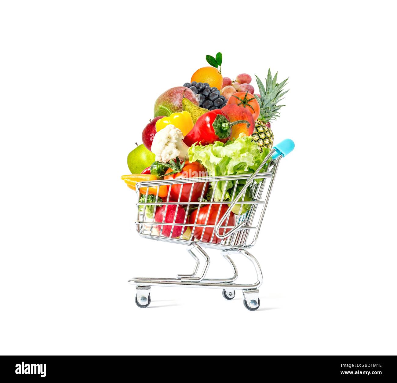 Fresh vegetables and fruits in a crowded shopping cart isolated on a