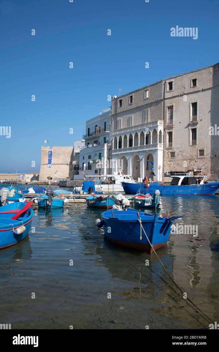 Colourful wooden boats in the harbour in Monopoli, Puglia, Italy, Europe Stock Photo