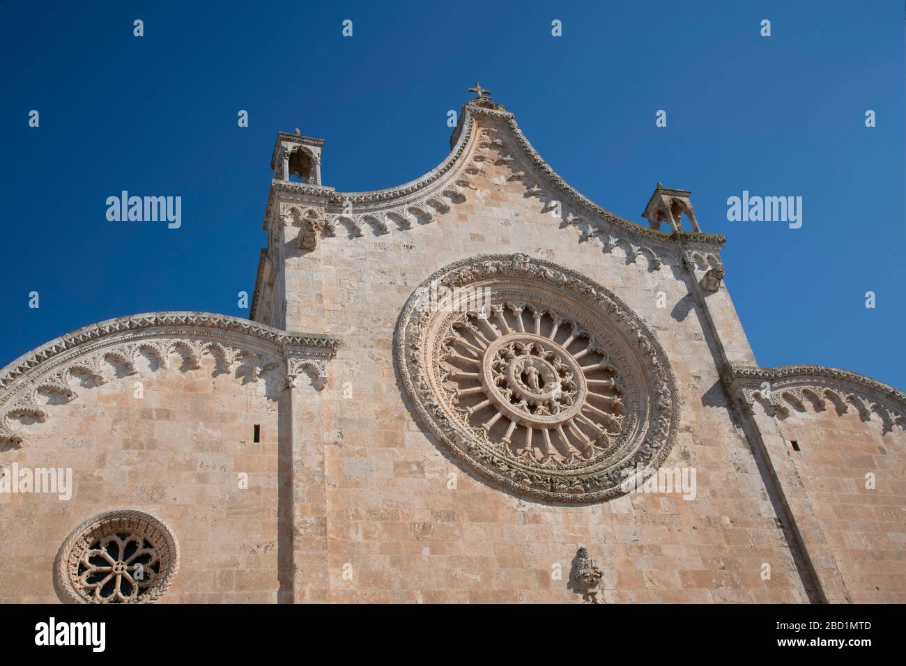 The rose window on the Cathedral of Santa Maria dell Assunzione in Ostuni, Puglia, Italy, Europe Stock Photo