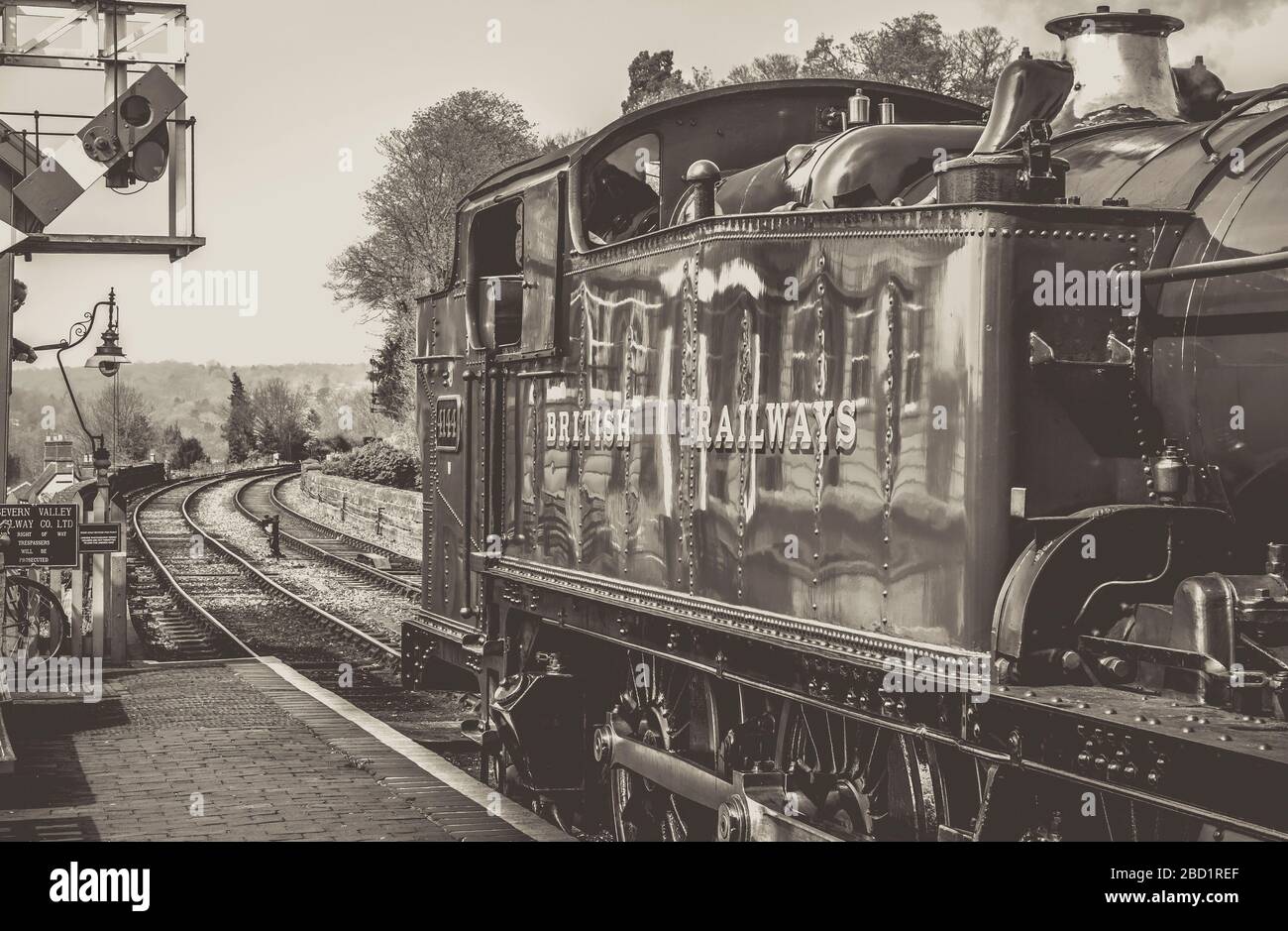 Black & white steam train leaving Bewdley vintage train station, Severn Valley heritage steam railway. UK steam locomotives. Stock Photo